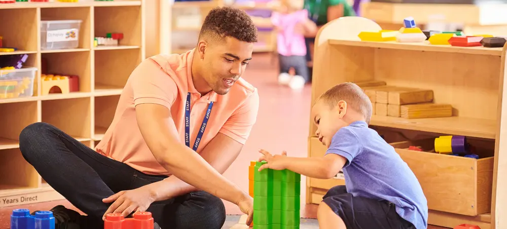 Early Intervention program administrator interacts with child.