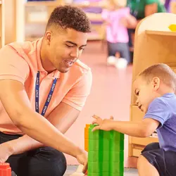 Early Intervention program administrator interacts with child.