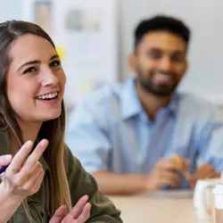 Professionals meeting around a table.